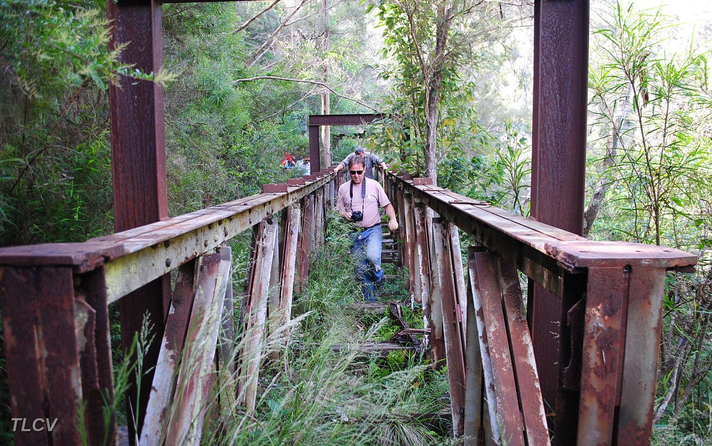 03-Gunther walks across the broken bridge at Coopers Creek.JPG
